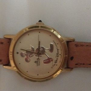 Ladies mickey mouse watch with tan watch band